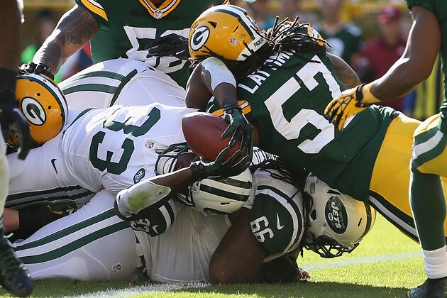 GREEN BAY, WI - SEPTEMBER 14: Running back Chris Ivory #33 of the New York Jets stretches the ball over the goal line to score a touchdown against the Green Bay Packers in the second quarter during the NFL game at Lambeau Field on September 14, 2014 in Green Bay, Wisconsin. (Photo by Christian Petersen/Getty Images) GREEN BAY, WI - SEPTEMBER 14: Running back Chris Ivory #33 of the New York Jets stretches the ball over the goal line to score a touchdown against the Green Bay Packers in the second quarter during the NFL game at Lambeau Field on September 14, 2014 in Green Bay, Wisconsin. (Photo by Christian Petersen/Getty Images)