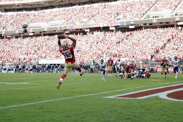 SANTA CLARA, CA - SEPTEMBER 14:  Wide receiver Michael Crabtree #15 of the San Francisco 49ers catches a touchdown pass in the first quarter of a game against the Chicago Bears at Levi's Stadium on September 14, 2014 in Santa Clara, California.  (Photo by Ezra Shaw/Getty Images)