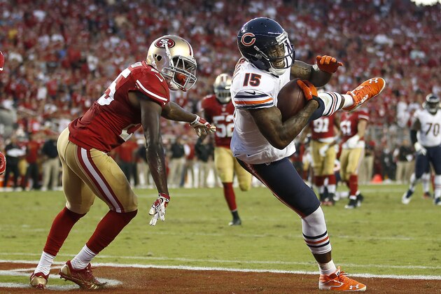 Chicago Bears wide receiver Brandon Marshall (15) catches a 17-yard touchdown in front of San Francisco 49ers strong safety Jimmie Ward during the second quarter of an NFL football game in Santa Clara, Calif., Sunday, Sept. 14, 2014. (AP Photo/Tony Avelar)