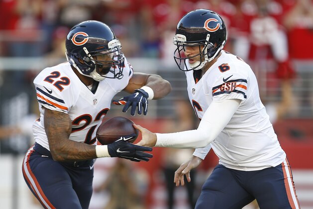 Chicago Bears quarterback Jay Cutler (6) hands off to running back Matt Forte (22) during the first quarter of an NFL football game against the San Francisco 49ers in Santa Clara, Calif., Sunday, Sept. 14, 2014. (AP Photo/Tony Avelar)