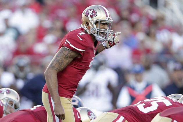 San Francisco 49ers quarterback Colin Kaepernick (7) yells at the line of scrimmage during the first quarter of an NFL football game against the Chicago Bears in Santa Clara, Calif., Sunday, Sept. 14, 2014. (AP Photo/Marcio Jose Sanchez)