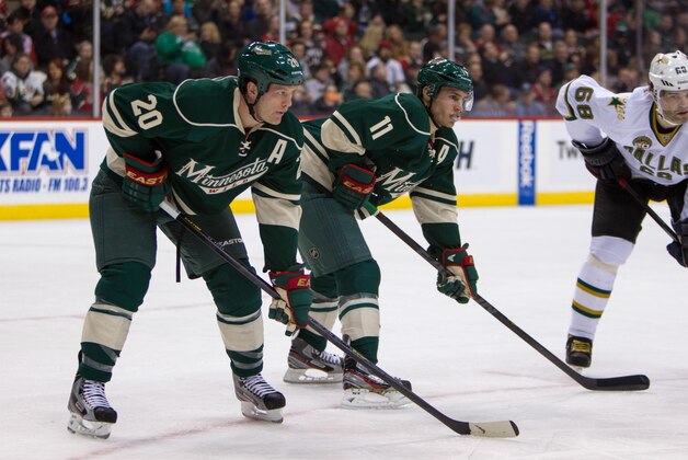 Jan 20, 2013; St. Paul, MN, USA; Minnesota Wild forward Zach Parise (11) and defenseman Ryan Suter (20) against the Dallas Stars at the Xcel Energy Center. The Wild defeated the Stars 1-0. Mandatory Credit: Brace Hemmelgarn-USA TODAY Sports