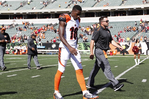 Cincinnati Bengals wide receiver A.J. Green (18) walks off the field after the Bengals defeated the Atlanta Falcons 24-10 in an NFL football game, Sunday, Sept. 14, 2014, in Cincinnati. Green left the game early with a toe injury. (AP Photo/Frank Victores)