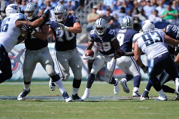 NASHVILLE, TN - SEPTEMBER 14:  DeMarco Murray #29 of the Dallas Cowboys rushes against the Tennessee Titans in the second half of a game at LP Field on September 14, 2014 in Nashville, Tennessee.  (Photo by Frederick Breedon/Getty Images)