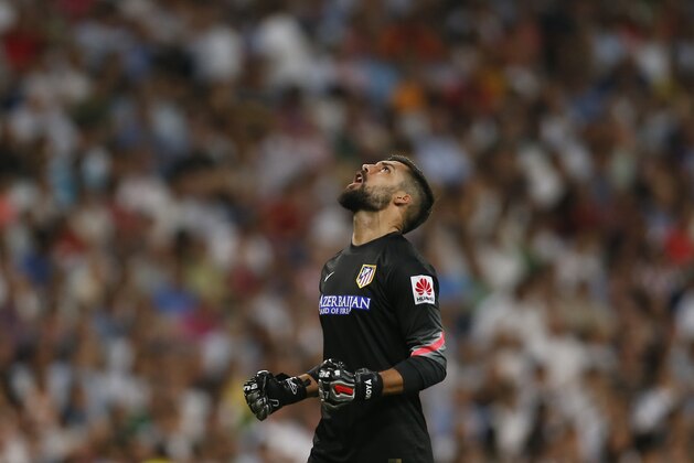 Atletico de Madrid's goalkeeper Miguel Angel Moya celebrates a goal during a Spanish La Liga soccer match against Real Madrid at the Santiago Bernabeu stadium in Madrid, Spain, Saturday, Sept. 13, 2014 . (AP Photo/Daniel Ochoa de Olza)