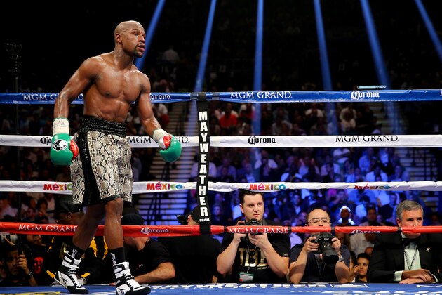 LAS VEGAS, NV - SEPTEMBER 13:  Floyd Mayweather Jr. looks on while taking on Marcos Maidana during their WBC/WBA welterweight title fight at the MGM Grand Garden Arena on September 13, 2014 in Las Vegas, Nevada.  (Photo by Al Bello/Getty Images)