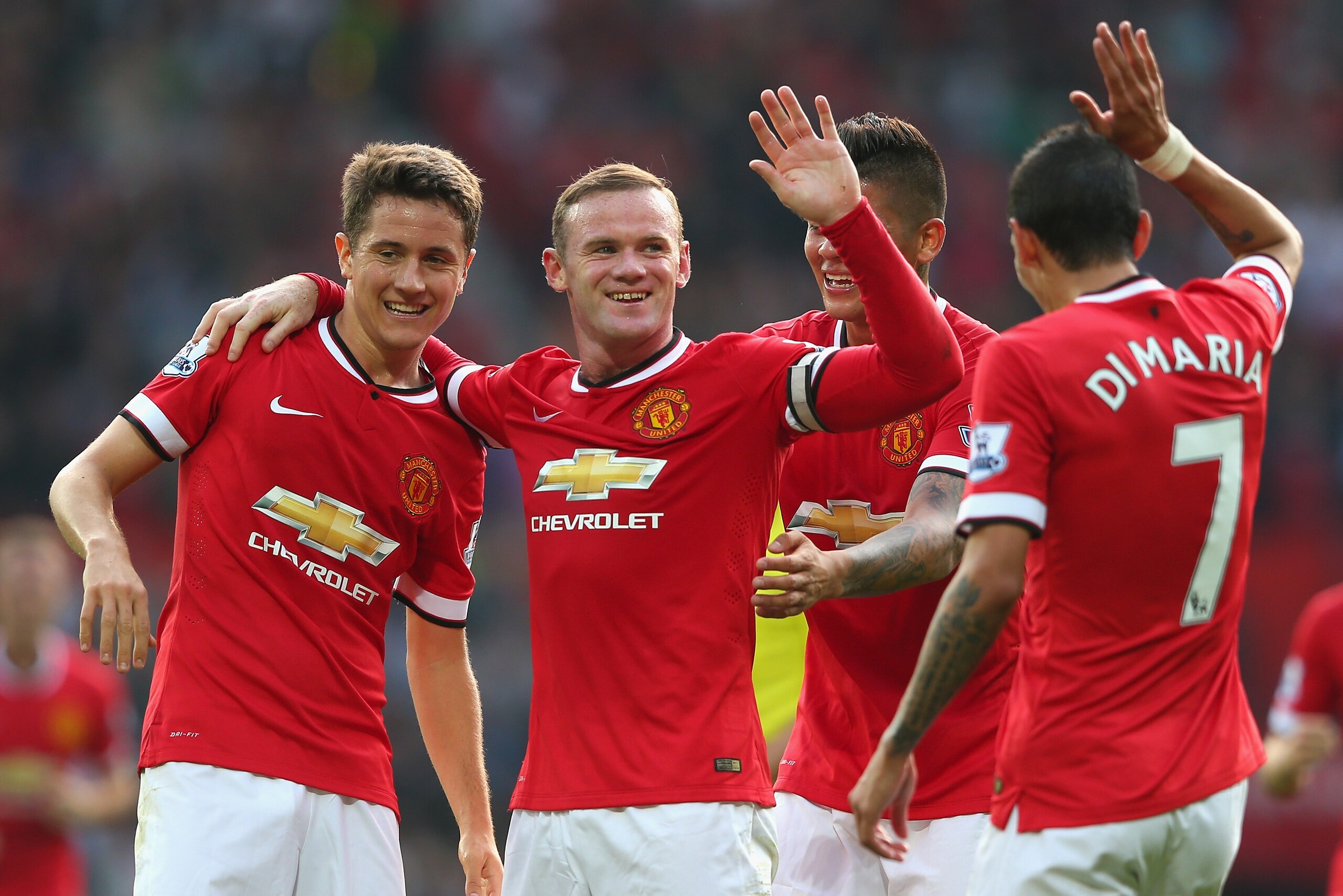 MANCHESTER, ENGLAND - SEPTEMBER 14: Wayne Rooney of Manchester United celebrates scoring the third goal with team-mates Ander Herrera (L), Marcos Rojo and Angel Di Maria during the Barclays Premier League match between Manchester United and Queens Park Rangers at Old Trafford on September 14, 2014 in Manchester, England. (Photo by Alex Livesey/Getty Images) MANCHESTER, ENGLAND - SEPTEMBER 14: Wayne Rooney of Manchester United celebrates scoring the third goal with team-mates Ander Herrera (L), Marcos Rojo and Angel Di Maria during the Barclays Premier League match between Manchester United and Queens Park Rangers at Old Trafford on September 14, 2014 in Manchester, England. (Photo by Alex Livesey/Getty Images)