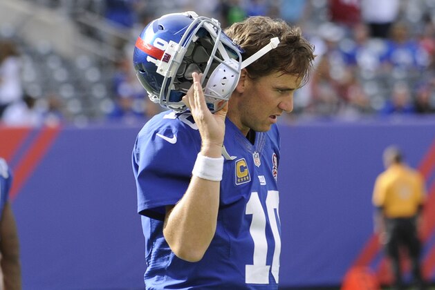 New York Giants quarterback Eli Manning (10) reacts after throwing an interception during the second half of an NFL football game against the Arizona Cardinals Sunday, Sept. 14, 2014, in East Rutherford, N.J. The Cardinals won the game 25-14. (AP Photo/Bill Kostroun)