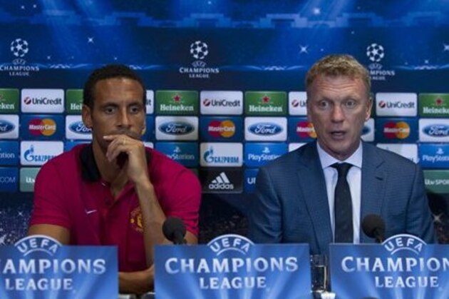 FILE - A Monday, Sept. 16, 2013 photo from files showing Manchester United's manager David Moyes, right, sitting alongside Rio Ferdinand as he speaks during a news conference at Old Trafford Stadium, Manchester, England. Rio Ferdinand says he is leaving Manchester United after 12 years at the Premier League club but is set to continue playing. The 35-year-old former England defender has not been offered an extension to his contract that expires next month. (AP Photo/Jon Super, File)