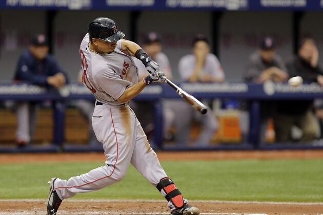 Boston Red Sox's Mookie Betts hits an RBI single off Tampa Bay Rays starting pitcher Alex Cobb during the fifth inning of a baseball game Sunday, Aug. 31, 2014, in St. Petersburg, Fla. Red Sox's Brock Holt scored. (AP Photo/Chris O'Meara)