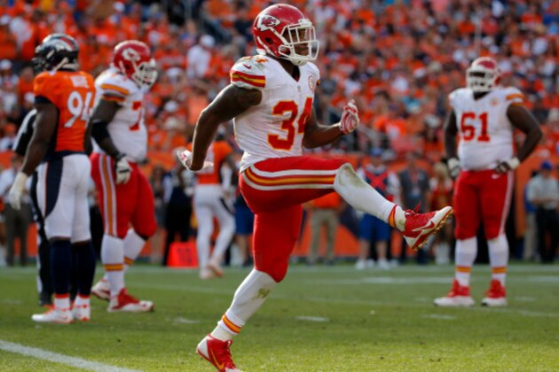 DENVER, CO - SEPTEMBER 14:  Running back Knile Davis #34 of the Kansas City Chiefs celebrates a fourth quarter touchdown against the Denver Broncos during a game at Sports Authority Field at Mile High on September 14, 2014 in Denver, Colorado.  (Photo by Doug Pensinger/Getty Images)