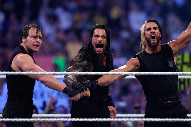 The Shield reacts after their win during Wrestlemania XXX at the Mercedes-Benz Super Dome in New Orleans on Sunday, April 6, 2014. (Jonathan Bachman/AP Images for WWE)