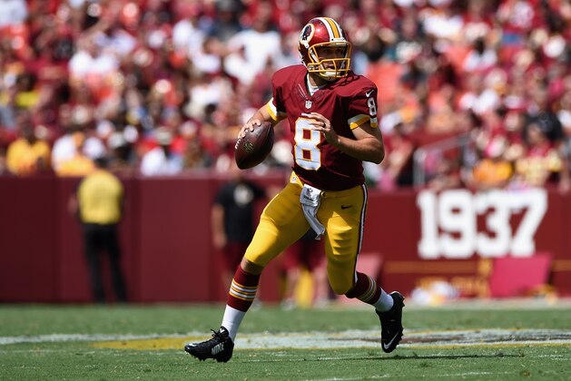 LANDOVER, MD - SEPTEMBER 14: Quarterback Kirk Cousins #8 of the Washington Redskins rolls out during a game against the Jacksonville Jaguars at FedExField on September 14, 2014 in Landover, Maryland.  (Photo by Patrick Smith/Getty Images)