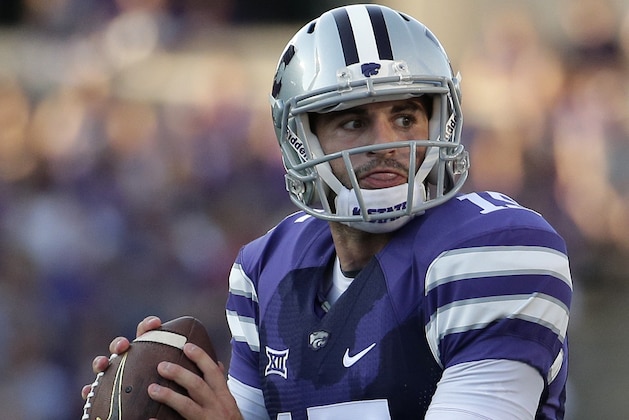 Kansas State quarterback Jake Waters (15) looks for a receiver during the first half of an NCAA college football game against the Stephen F. Austin Saturday, Aug. 30, 2014, in Manhattan, Kan. (AP Photo/Charlie Riedel)