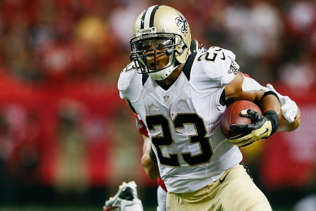 ATLANTA, GA - SEPTEMBER 07:  Pierre Thomas #23 of the New Orleans Saints stiff arms Paul Worrilow #55 of the Atlanta Falcons on a run in the second half at the Georgia Dome on September 7, 2014 in Atlanta, Georgia.  (Photo by Kevin C. Cox/Getty Images)