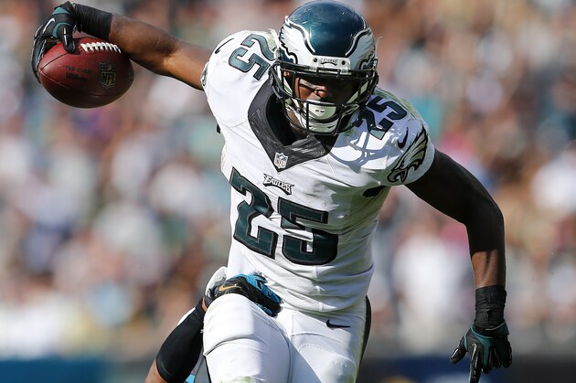PHILADELPHIA, PA - SEPTEMBER 07:  LeSean McCoy #25 of the Philadelphia Eagles runs for a first down as Josh Evans #26 of the Jacksonville Jaguars attempts a tackle during the fourth quarter of a NFL game at Lincoln Financial Field on September 7, 2014 in Philadelphia, Pennsylvania. The Eagles defeated the Jaguars 34-17. (Photo by Rich Schultz /Getty Images)