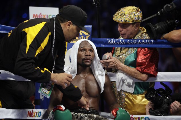 Floyd Mayweather speaks to his corner during his WBA welterweight and WBC super welterweight title fight against Marcos Maidana, Saturday, Sept. 13, 2014, in Las Vegas. (AP Photo/John Locher) Floyd Mayweather speaks to his corner during his WBA welterweight and WBC super welterweight title fight against Marcos Maidana, Saturday, Sept. 13, 2014, in Las Vegas. (AP Photo/John Locher)