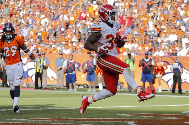 Kansas City Chiefs running back Knile Davis (34) scores against the Denver Broncos during the second half of an NFL football game, Sunday, Sept. 14, 2014, in Denver. (AP Photo/Jack Dempsey)