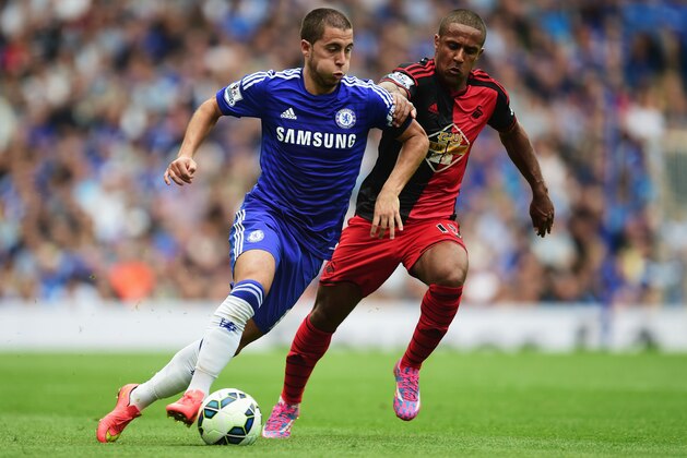 LONDON, ENGLAND - SEPTEMBER 13: Eden Hazard of Chelsea takes on Wayne Routledge of Swansea City during the Barclays Premier League match between Chelsea and Swansea City at Stamford Bridge on September 13, 2014 in London, England. (Photo by Jamie McDonald/Getty Images) LONDON, ENGLAND - SEPTEMBER 13: Eden Hazard of Chelsea takes on Wayne Routledge of Swansea City during the Barclays Premier League match between Chelsea and Swansea City at Stamford Bridge on September 13, 2014 in London, England. (Photo by Jamie McDonald/Getty Images)