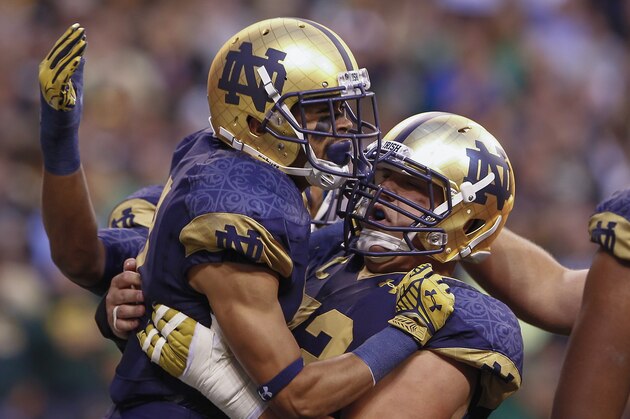 INDIANAPOLIS, IN - SEPTEMBER 13: William Fuller #7 of the Notre Dame Fighting Irish and Nick Martin #72 of the Notre Dame Fighting Irish celebrate a touchdown during the game against the Purdue Boilermakers at Lucas Oil Stadium on September 13, 2014 in Indianapolis, Indiana.  (Photo by Michael Hickey/Getty Images)