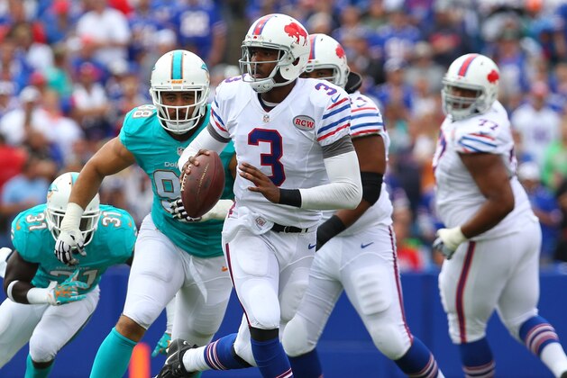 Buffalo Bills quarterback EJ Manuel (3) runs against the Miami Dolphins during the first half of an NFL football game on Sunday, Sept. 14, 2014, in Orchard Park, N.Y. (AP Photo/Bill Wippert)