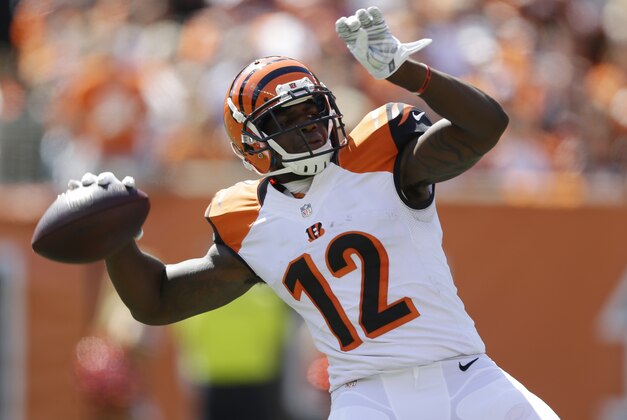 Cincinnati Bengals wide receiver Mohamed Sanu throws a 50-yard pass in the first half of an NFL football game against the Atlanta Falcons, Sunday, Sept. 14, 2014, in Cincinnati. (AP Photo/Michael Conroy)
