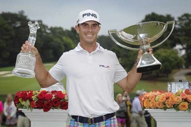 Bill Horschel poses with both trophies after winning the Tour Championship golf tournament and The FedEX Cup, Sunday, Sept 14, 2014, in Atlanta. (AP Photo/John Amis)