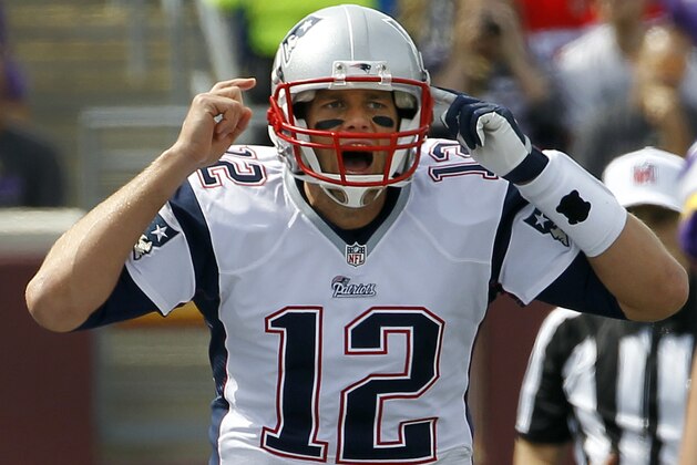 New England Patriots quarterback Tom Brady yells on the line of scrimmage during the first quarter of an NFL football game against the Minnesota Vikings, Sunday, Sept. 14, 2014, in Minneapolis. (AP Photo/Ann Heisenfelt)