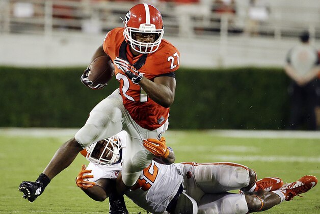 Georgia's Nick Chubb, left, breaks free from the tackle of Clemson's Stephone Anthony to run for a touchdown in the second half of an NCAA college football game, Saturday, Aug. 30, 2014, in Athens, Ga. (AP Photo/David Goldman)