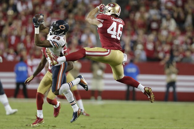 Chicago Bears cornerback Kyle Fuller (23) intercepts a pass intended for San Francisco 49ers tight end Derek Carrier (46) during the fourth quarter of an NFL football game in Santa Clara, Calif., Sunday, Sept. 14, 2014. (AP Photo/Marcio Jose Sanchez)