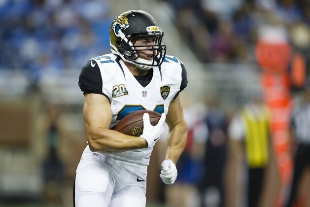 Jacksonville Jaguars running back Toby Gerhart (21) runs against the Detroit Lions in the first half of a preseason NFL football game at Ford Field in Detroit, Friday, Aug. 22, 2014. (AP Photo/Rick Osentoski)