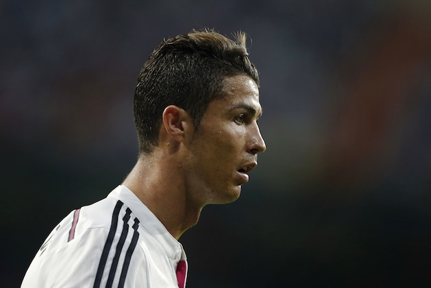 Real Madrid's Cristiano Ronaldo reacts during a Spanish Super Cup soccer match against Atletico Madrid at Santiago Bernabeu stadium in Madrid, Spain, Tuesday, Aug. 19, 2014 . (AP Photo/Daniel Ochoa de Olza)