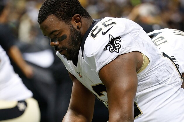 NEW ORLEANS, LA - AUGUST 15:  Mark Ingram #22 of the New Orleans Saints kneels during the National Anthem before a preseason game against the Tennessee Titans at the Mercedes-Benz Superdome on August 15, 2014 in New Orleans, Louisiana.  (Photo by Stacy Revere/Getty Images)