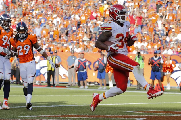 Kansas City Chiefs running back Knile Davis (34) scores against the Denver Broncos during the second half of an NFL football game, Sunday, Sept. 14, 2014, in Denver. (AP Photo/Jack Dempsey)