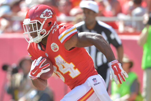 Sep 7, 2014; Kansas City, MO, USA; Kansas City Chiefs running back Knile Davis (34) returns a kick during the second half against the Tennessee Titans at Arrowhead Stadium. The Titans won 26-10. Mandatory Credit: Denny Medley-USA TODAY Sports