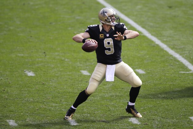 New Orleans Saints quarterback Drew Brees looks to throw during an NFL football game against the Cleveland Browns Sunday, Sept. 14, 2014, in Cleveland. (AP Photo/Tony Dejak)