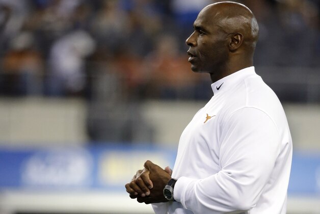 Texas coach Charlie Strong watches his team before an NCAA college football game against UCLA, Saturday, Sept. 13, 2014, in Arlington, Texas. (AP Photo/Tony Gutierrez)