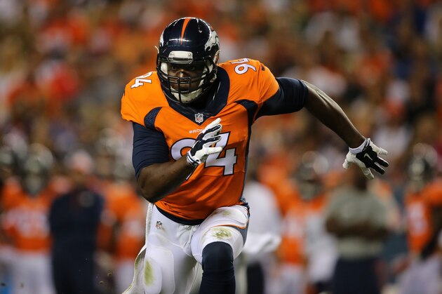 DENVER, CO - AUGUST 07:  Defensive end DeMarcus Ware #94 of the Denver Broncos rushes against the Seattle Seahawks during preseason action at Sports Authority Field at Mile High on August 7, 2014 in Denver, Colorado. The Broncos defeated the Seahawks 21-16.  (Photo by Doug Pensinger/Getty Images)