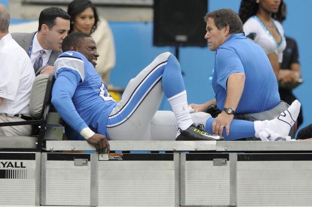 Detroit Lions' Nevin Lawson (43) is carted off the field during the second half of an NFL football game against the Carolina Panthers in Charlotte, N.C., Sunday, Sept. 14, 2014. (AP Photo/Mike McCarn)