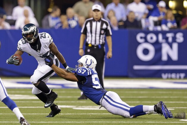 Philadelphia Eagles running back LeSean McCoy (25) is tackled by Indianapolis Colts linebacker Josh McNary (57) during the first half of an NFL football game Monday, Sept. 15, 2014, in Indianapolis. (AP Photo/Michael Conroy)