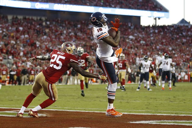 Chicago Bears wide receiver Brandon Marshall (15) catches a 17-yard touchdown in front of San Francisco 49ers strong safety Jimmie Ward during the second quarter of an NFL football game in Santa Clara, Calif., Sunday, Sept. 14, 2014. (AP Photo/Tony Avelar)