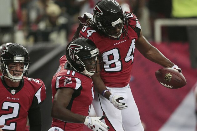 Atlanta Falcons wide receiver Roddy White (84) celebrates his touchdown against the New Orleans Saints with Atlanta Falcons wide receiver Julio Jones (11) during the first half of an NFL football game, Sunday, Sept. 7, 2014, in Atlanta. (AP Photo/John Bazemore)