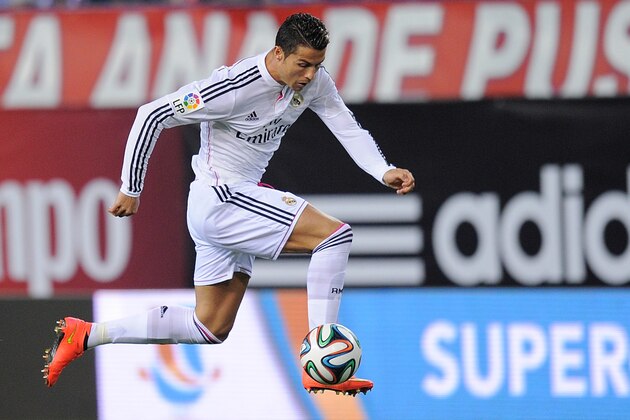 MADRID, SPAIN - AUGUST 22: Cristiano Ronaldo of Real Madrid in action during the Supercopa, second leg match between Club Atletico de Madrid and Real Madrid at Vicente Caldron stadium on August 22, 2014 in Madrid, Spain.  (Photo by Denis Doyle/Getty Images)