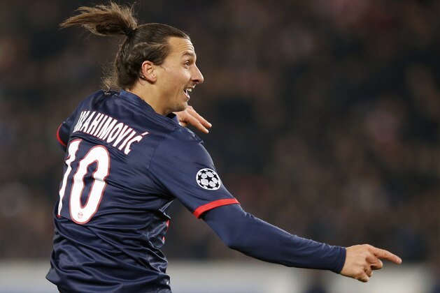 PSG's Zlatan Ibrahimovic looks on as he kicks the ball during the Group C Champions League soccer match between Paris Saint Germain and Olympiakos FC at the Parc des Princes stadium in Paris, France, Wednesday, Nov. 27, 2013. (AP Photo/Francois Mori)