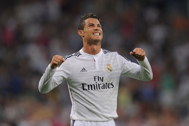 MADRID, SPAIN - AUGUST 25:  Cristiano Ronaldo of Real Madrid celebrates after scoring Real's 2nd goal during the La liga match between Real Madrid CF and Cordoba CF at Estadio Santiago Bernabeu on August 25, 2014 in Madrid, Spain.  (Photo by Denis Doyle/Getty Images)