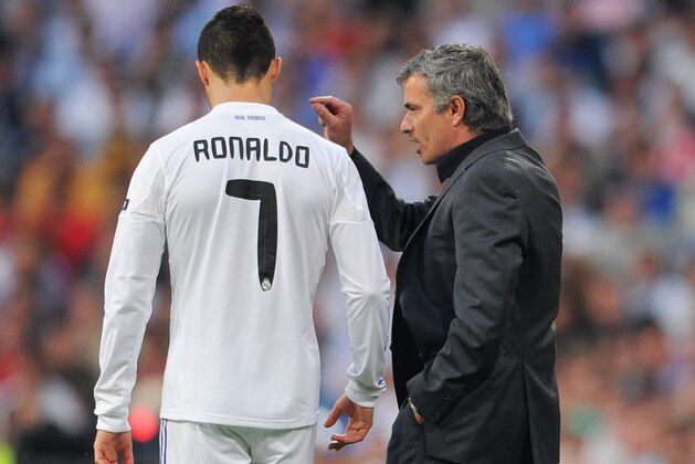 MADRID, SPAIN - APRIL 27:  Head coach Jose Mourinho (R) of Real Madrid instructs Cristiano Ronaldo during the UEFA Champions League Semi Final first leg match between Real Madrid and Barcelona at the Estadio Santiago Bernabeu on April 27, 2011 in Madrid, Spain.  (Photo by Jasper Juinen/Getty Images)