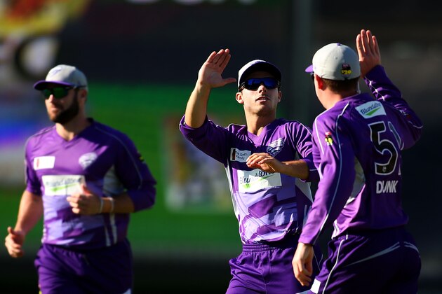 PERTH, AUSTRALIA - FEBRUARY 07:  Ben Dunk of the Hurricanes is congratulated by Jonathan Wells after taking a catch to dismiss Simon Katich of the Scorchers during the Big Bash League Final match between the Perth Scorchers and the Hobart Hurricanes at the WACA on February 7, 2014 in Perth, Australia.  (Photo by Paul Kane/Getty Images)