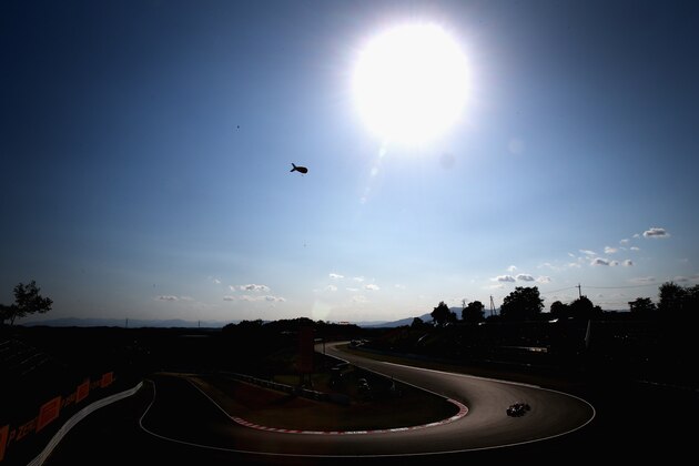 SUZUKA, JAPAN - OCTOBER 13:  Fernando Alonso of Spain and Ferrari drives during the Japanese Formula One Grand Prix at Suzuka Circuit on October 13, 2013 in Suzuka, Japan.  (Photo by Clive Mason/Getty Images)