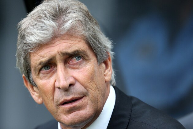 Manchester City's manager Manuel Pellegrini look's on ahead of their English Premier League soccer match against Newcastle United at St James' Park, Newcastle, England, Sunday, Aug. 17, 2014. (AP Photo/Scott Heppell)