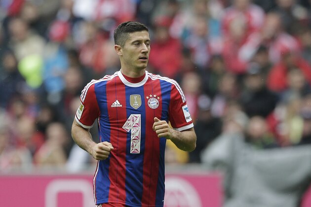 Bayern's Robert Lewandowski from Poland watches his team mates during the soccer match between FC Bayern Munich and VfB Stuttgart in the Allianz Arena in Munich, Germany, on Saturday, Sept. 13, 2014. (AP Photo/Matthias Schrader)